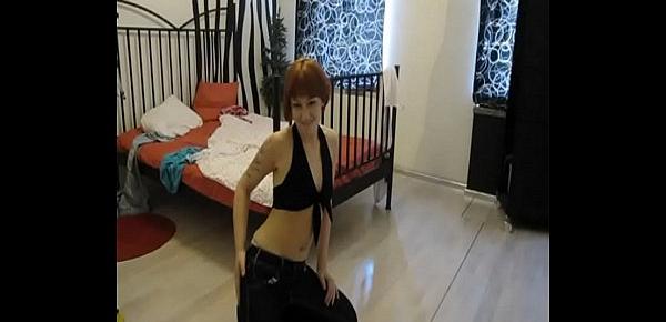  Tattooed redhead dances in a casual outfit